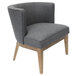 A slate gray Ava accent chair with wooden legs and a grey fabric seat.