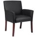 A Boss black leather arm guest chair with mahogany legs.