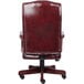 A Boss red leather office chair with a black base.