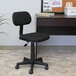 A black Boss steno chair in front of a desk.