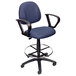 A blue Boss drafting stool with black arms.