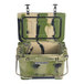 A green and camouflage CaterGator outdoor cooler with a handle.