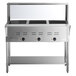 A stainless steel ServIt electric steam table with undershelf and sneeze guard.