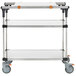 A Metro PrepMate MultiStation metal cart with stainless steel shelving and cutting board.