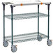 A Metro PrepMate MultiStation cart with MetroSeal 3 shelves and wheels with a white surface.