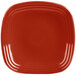 A Fiesta® Scarlet square luncheon plate with a red rim.