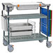 A Metro PrepMate MultiStation cart with metal trays on it.