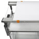 Metro PrepMate MultiStation with galvanized shelving and a white cutting board on top.