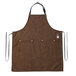 A brown Hardmill canvas apron with black straps.