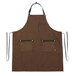A brown Hardmill canvas bib apron with black straps and pockets.