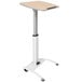 A white Luxor pneumatic adjustable height lectern on wheels.