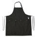 A black Hardmill canvas bib apron with straps and two pockets.