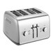 A silver KitchenAid 4-slice toaster with knobs and buttons.