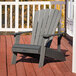 A gray Lifetime Adirondack chair on a deck.