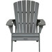 A gray wooden Adirondack chair with armrests.