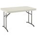 A white rectangular Lifetime plastic folding table with metal legs.