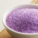 A bowl of lavender sanding sugar.