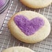 A heart-shaped cookie with Lavender Sanding Sugar on top.
