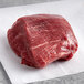 A piece of raw Warrington Farm Meats Filet Mignon steak on a white paper.