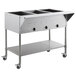 A stainless steel ServIt open well electric steam table on an undershelf.