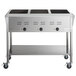 A stainless steel ServIt food warmer with three pans in it on a counter with an undershelf.