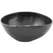 A black bowl with a small hole in the middle.