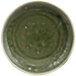 A green porcelain plate with a circular pattern.