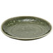 A Front of the House Leek porcelain plate with a green surface.