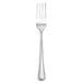 A silver Walco Poise dinner fork with a white background.