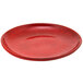 A red porcelain plate with a speckled surface.