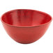 A red bowl with a shiny surface.