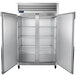 A white Traulsen G Series reach-in freezer with two doors open.