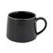 A black porcelain cup with a handle.
