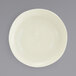 A close up of a white Front of the House Kiln porcelain plate with a small rim.