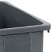 A close-up of a Carlisle Trimline 23 gallon grey rectangular trash can.