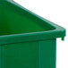 A green plastic Carlisle Trimline rectangular recycle bin with white text.