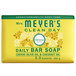 A yellow and white Mrs. Meyer's Clean Day honeysuckle bar of soap.