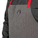 A Uncommon Chef grey poly-cotton apron with red stitching and 3 pockets.