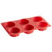 A red silicone 6 compartment sunflower mold by Thunder Group.