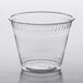 A Fabri-Kal Kal-Clear clear plastic cup on a white surface.