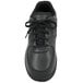 A close-up of a black Genuine Grip women's athletic shoe with laces.