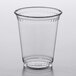 A clear plastic Fabri-Kal cup on a white surface.