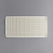 A white rectangular Rubbermaid shower mat with holes.