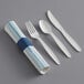 A Hoffmaster EarthWise plastic fork and spoon set next to a blue and white striped napkin.