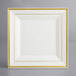 A Visions white square plastic plate with gold trim.