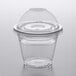 A Choice clear plastic squat cup with a clear lid on a table.