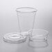 A clear plastic cup with a Choice clear plastic lid with an insert.