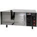 A stainless steel Benchmark USA countertop pizza oven with knobs and a control panel.