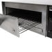A stainless steel Benchmark USA countertop pizza oven with a drawer open.