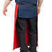 A man wearing a red and black Uncommon Chef Muse bistro apron.
